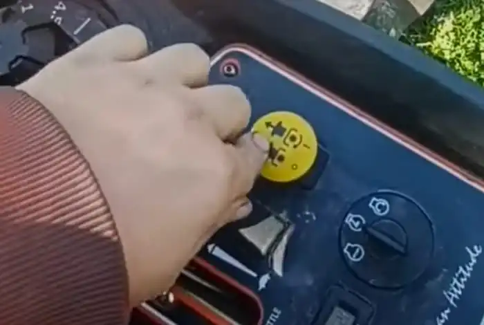 image of disengaging the safety features of a bad boy zero turn lawn mower