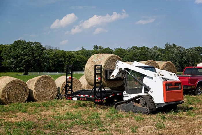 image of a skid steer working in an agricultural farm