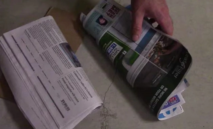 image of removing the newspaper