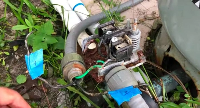 image of stripping off wire ends to remove the old switch