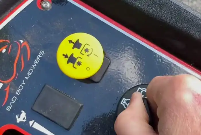 image of turning ignition key of bad boy zero turn lawn mower